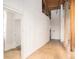 Hallway featuring modern white walls, wooden beams and doors, and concrete floors at 204 Walker Sw St # 319, Atlanta, GA 30313