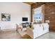 Cozy living room with exposed brick wall, large window, and comfortable seating at 204 Walker Sw St # 319, Atlanta, GA 30313