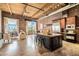 Bright living space featuring exposed brick, wood ceilings, and a kitchen island with seating at 204 Walker Sw St # 319, Atlanta, GA 30313