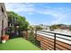 Outdoor patio featuring green turf, a black metal railing, and skyline views at 204 Walker Sw St # 319, Atlanta, GA 30313