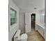 Clean bathroom featuring a single sink vanity, modern fixtures, and a view into bedroom at 26 Nottingham Nw Dr, Cartersville, GA 30121