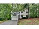 Charming two-story home with a well-maintained yard, garage, and inviting front entrance at 26 Nottingham Nw Dr, Cartersville, GA 30121
