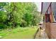 Backyard features a fence line and green trees at 3967 Norman Rd, Stone Mountain, GA 30083