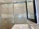 Updated bathroom with new mirror, a new sink, and a glass shower at 3967 Norman Rd, Stone Mountain, GA 30083