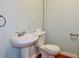 Bathroom features a pedestal sink and toilet at 3967 Norman Rd, Stone Mountain, GA 30083