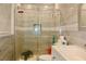 Bathroom featuring tiled shower with glass doors and modern vanity at 3967 Norman Rd, Stone Mountain, GA 30083