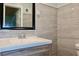 Modern bathroom featuring stylish gray marble-look tile and vanity at 3967 Norman Rd, Stone Mountain, GA 30083