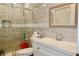 Bathroom featuring tiled shower with glass doors, toilet and modern vanity at 3967 Norman Rd, Stone Mountain, GA 30083