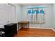 Bedroom features hardwood floors, a closet, and bright lighting at 3967 Norman Rd, Stone Mountain, GA 30083
