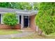Inviting front entrance with brick facade and well-manicured landscaping at 3967 Norman Rd, Stone Mountain, GA 30083