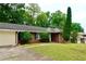Front exterior of home with mature trees at 3967 Norman Rd, Stone Mountain, GA 30083