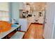 Spacious kitchen featuring white cabinets, wood floors, and modern appliances at 3967 Norman Rd, Stone Mountain, GA 30083