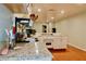 Open kitchen with stainless steel sink, granite countertops, and white appliances at 3967 Norman Rd, Stone Mountain, GA 30083
