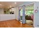 Living room featuring hardwood floors, and access to an outdoor patio space at 3967 Norman Rd, Stone Mountain, GA 30083