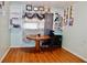 Office with hardwood floors, custom built-in bookshelves, a round table, and a large window at 3967 Norman Rd, Stone Mountain, GA 30083