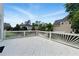 Large white wooden deck with open views of the back yard and surrounding neighborhood at 4011 Charrwood Trce, Marietta, GA 30062