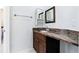 Bathroom with granite countertop and wooden cabinets at 4011 Charrwood Trce, Marietta, GA 30062