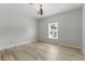 Bedroom featuring neutral walls, wood flooring and a window at 4011 Charrwood Trce, Marietta, GA 30062