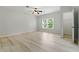 Spacious bedroom with wood floors, a ceiling fan, and closet at 4011 Charrwood Trce, Marietta, GA 30062
