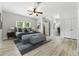 Modern bedroom with neutral tones, ceiling fan, and ample closet space at 4011 Charrwood Trce, Marietta, GA 30062