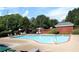Community pool with lounge chairs and mature landscaping at 4011 Charrwood Trce, Marietta, GA 30062
