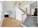 Bright foyer with hardwood floors, staircase with white banisters, and access to multiple rooms at 4011 Charrwood Trce, Marietta, GA 30062