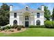 Elegant home featuring a manicured lawn, stately columns, and a grand entrance at 4011 Charrwood Trce, Marietta, GA 30062