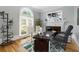 Bright home office with large desk, fireplace, and natural light at 4011 Charrwood Trce, Marietta, GA 30062
