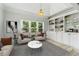 Bright living room with large windows, built-in shelving, and neutral decor at 4011 Charrwood Trce, Marietta, GA 30062