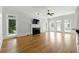 Bright and airy living room with hardwood floors, fireplace, ceiling fan and large windows at 4011 Charrwood Trce, Marietta, GA 30062