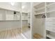 Spacious walk-in closet with ample shelving, drawers, and mirror at 4011 Charrwood Trce, Marietta, GA 30062