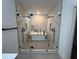 Modern bathroom featuring a glass-enclosed shower, a standalone bathtub, and dual shower heads at 4107 Danforth Sw Rd, Atlanta, GA 30331