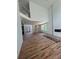 Spacious living room with hardwood floors, fireplace, high ceiling, and a modern open-concept design at 4107 Danforth Sw Rd, Atlanta, GA 30331