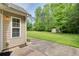 View of the large backyard with a storage shed, lush green grass, and an adjacent patio at 414 Pamela Ct, Mcdonough, GA 30252