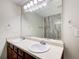 Bathroom features a double sink vanity, a large mirror, and ample lighting above the sinks at 414 Pamela Ct, Mcdonough, GA 30252