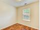 Bedroom featuring wood floors and a bright window view at 414 Pamela Ct, Mcdonough, GA 30252