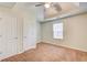 Bedroom with carpet flooring, a window, and white doors at 414 Pamela Ct, Mcdonough, GA 30252