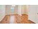 Dining room featuring hardwood floors, ample natural light, and classic wainscoting at 414 Pamela Ct, Mcdonough, GA 30252