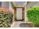 Close-up view of the front entrance adorned with stone accents and surrounded by vibrant shrubbery at 414 Pamela Ct, Mcdonough, GA 30252
