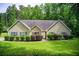 Charming ranch home featuring a well-manicured lawn and mature landscaping at 414 Pamela Ct, Mcdonough, GA 30252