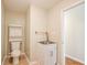 Bright half bathroom with tile flooring, a sink, and a cabinet at 414 Pamela Ct, Mcdonough, GA 30252