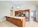 Kitchen features a long countertop, wood cabinets, stainless steel appliances, and neutral colors at 414 Pamela Ct, Mcdonough, GA 30252