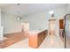 An open-concept kitchen boasting stainless steel appliances and a central island at 414 Pamela Ct, Mcdonough, GA 30252