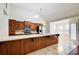 Spacious kitchen featuring a large island, stainless steel appliances, and open access to the dining area at 414 Pamela Ct, Mcdonough, GA 30252