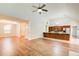 Spacious living area with vaulted ceilings, hardwood floors, open kitchen, and dining space at 414 Pamela Ct, Mcdonough, GA 30252