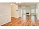 Open-concept living room featuring hardwood floors, fireplace, and abundant natural light at 414 Pamela Ct, Mcdonough, GA 30252