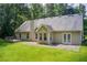 This home features an expansive yard, patio, and a small deck providing ample outdoor space at 414 Pamela Ct, Mcdonough, GA 30252
