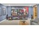 Basement theater area featuring blue walls, comfortable seating, and a large screen at 1213 Fairwinds Dr, Loganville, GA 30052