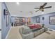 Finished basement with a large screen, comfortable seating, and surround sound system at 1213 Fairwinds Dr, Loganville, GA 30052