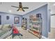 Finished basement featuring decor, comfortable seating, blue paint, and carpet at 1213 Fairwinds Dr, Loganville, GA 30052